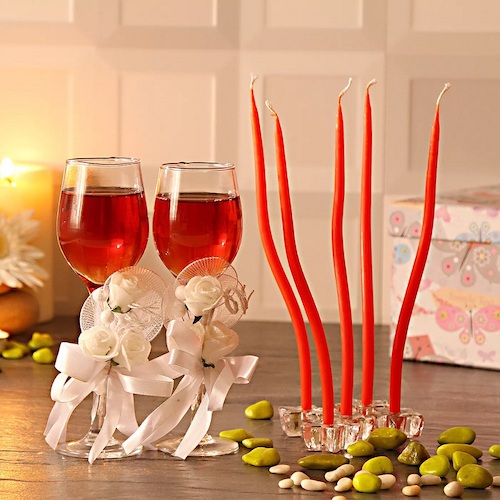 Classy Wine Glasses with Red Designer Candles and Candle Stand
